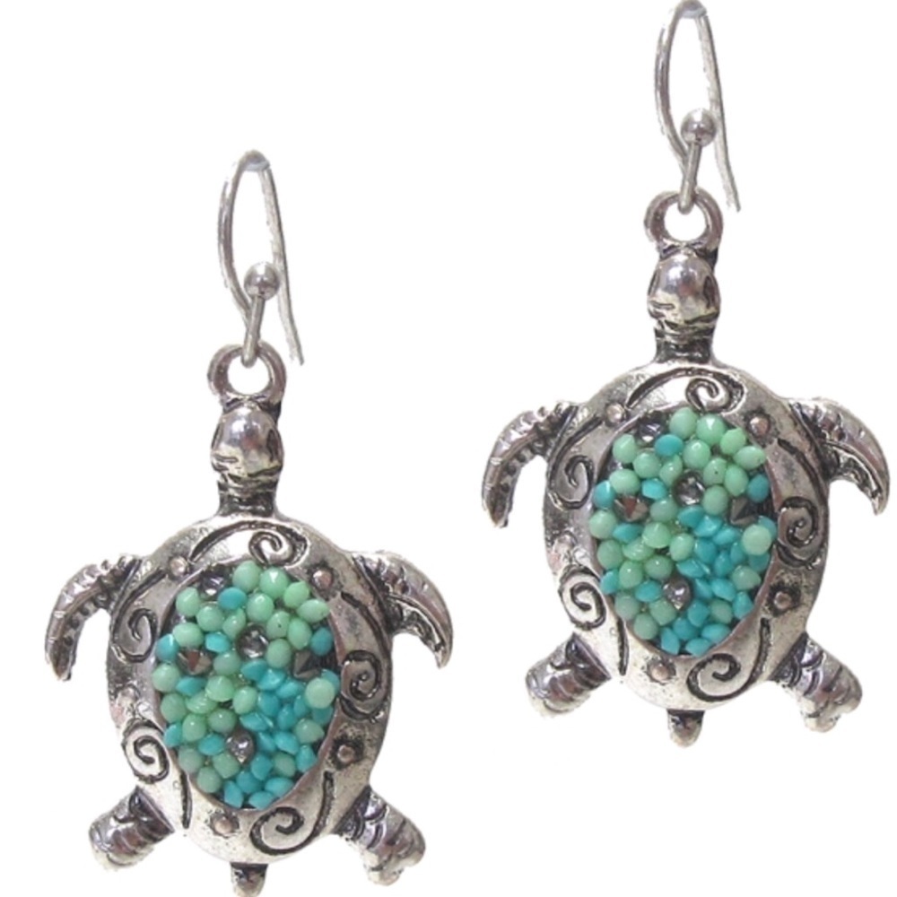 Love sea turtles?  Silver colored turtle earrings